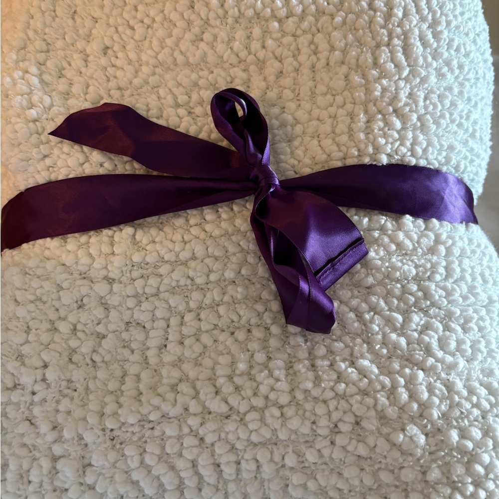 Barefoot Dreams Cream Throw with Purple Ribbon